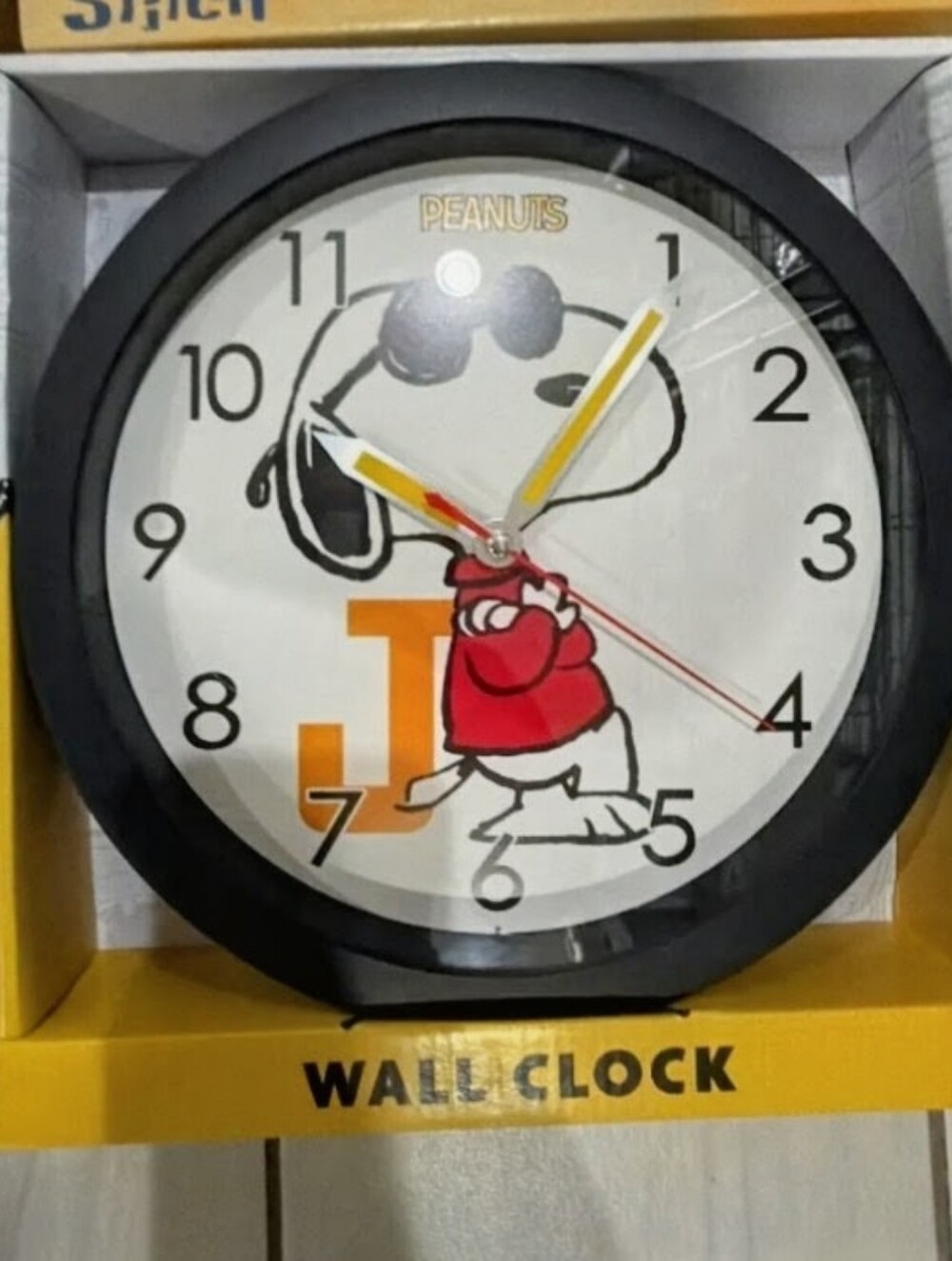 Peanuts Snoopy Black Frame Wall Clock with Red Sweater and Yellow Accents